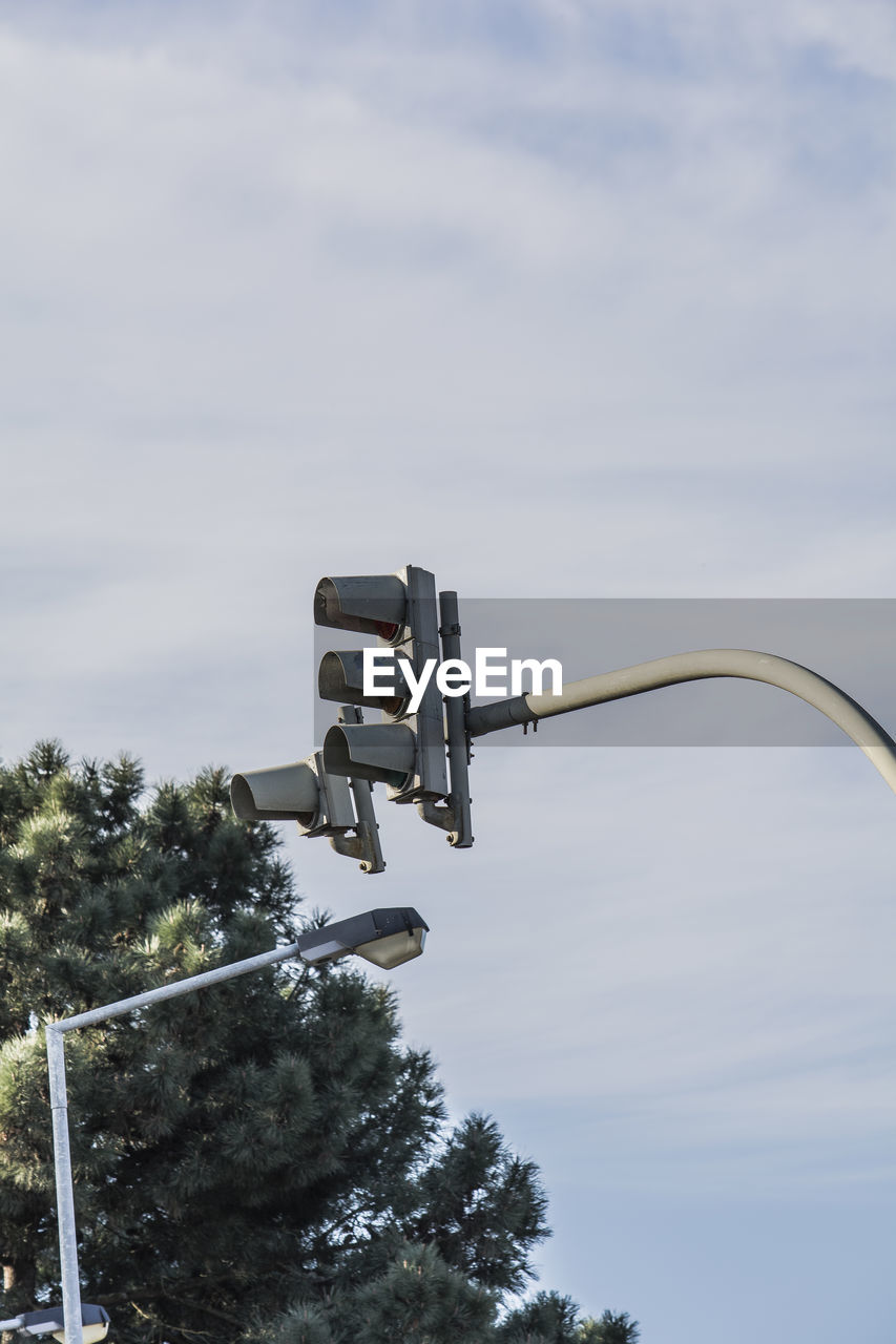 Low angle view of street light against sky