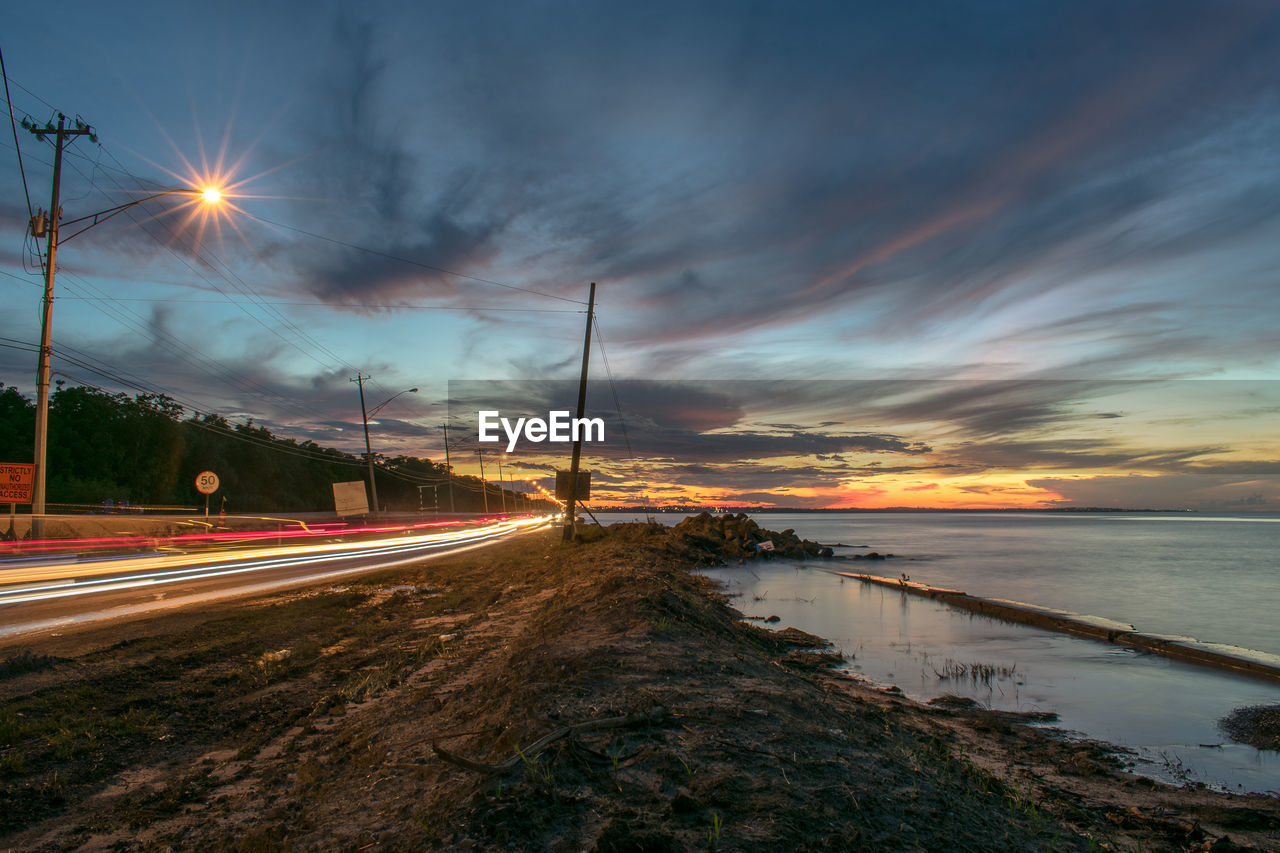 STREET AGAINST SKY DURING SUNSET