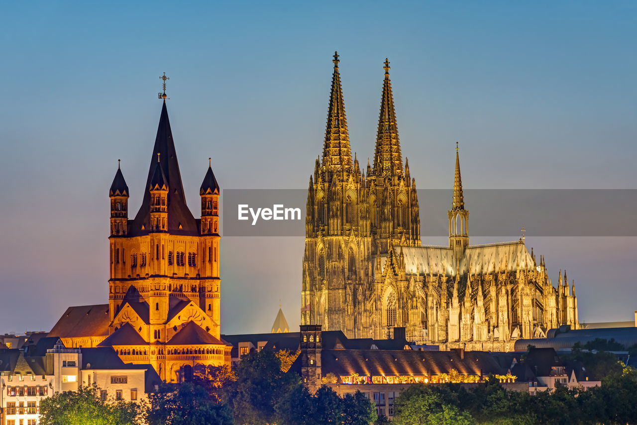 The famous cathedral and great st. martin church in cologne at dusk