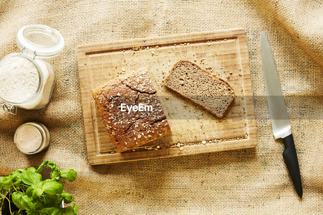 HIGH ANGLE VIEW OF BREAKFAST ON CUTTING BOARD