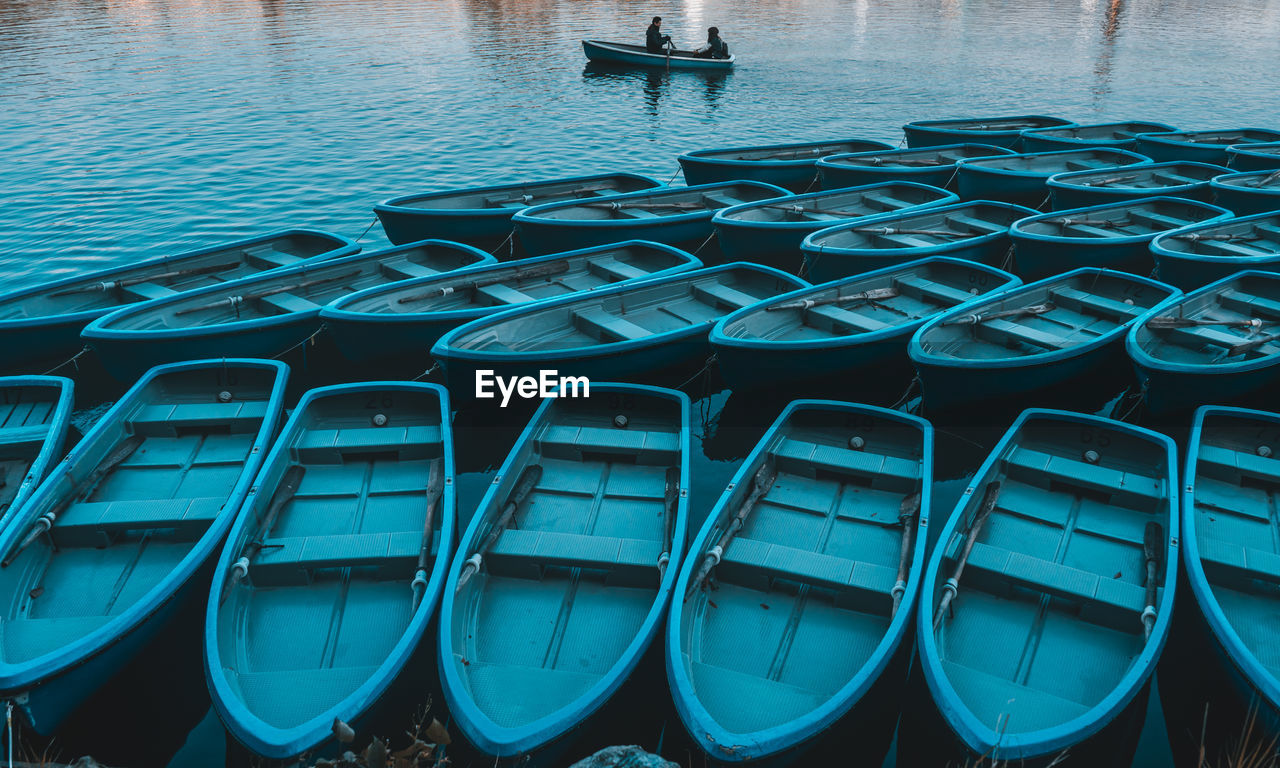 High angle view of boats moored in water