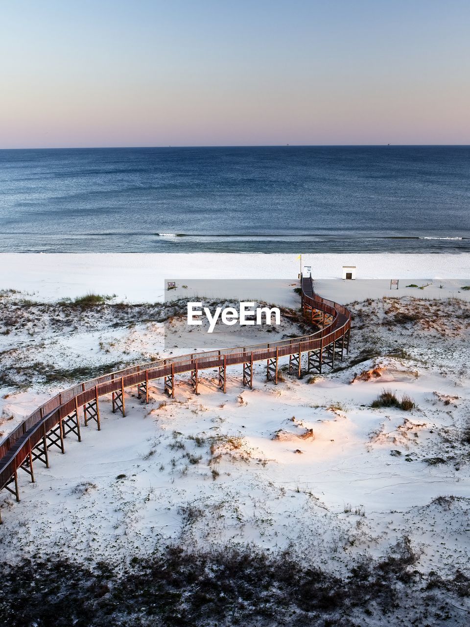 Scenic view of sea against clear sky during winter