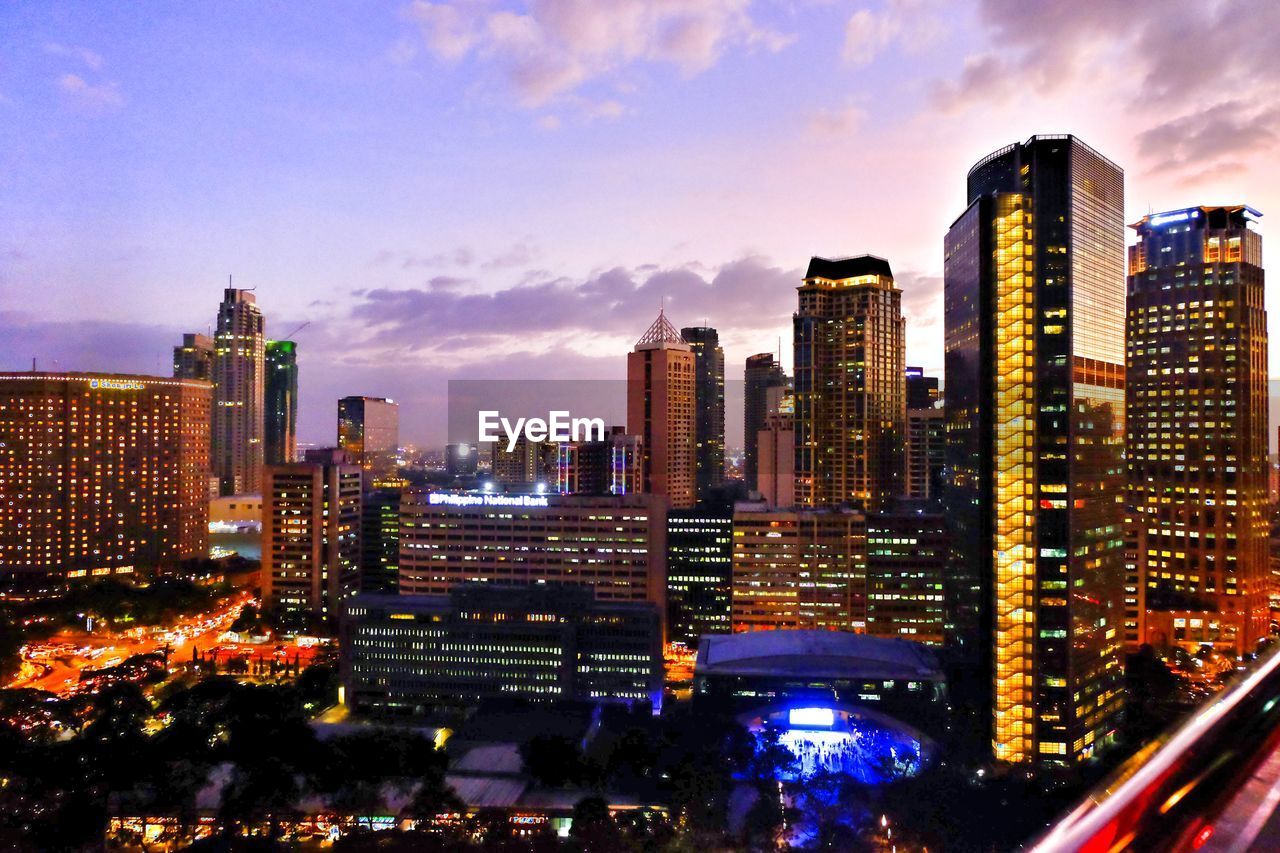 Aerial view of city lit up at night