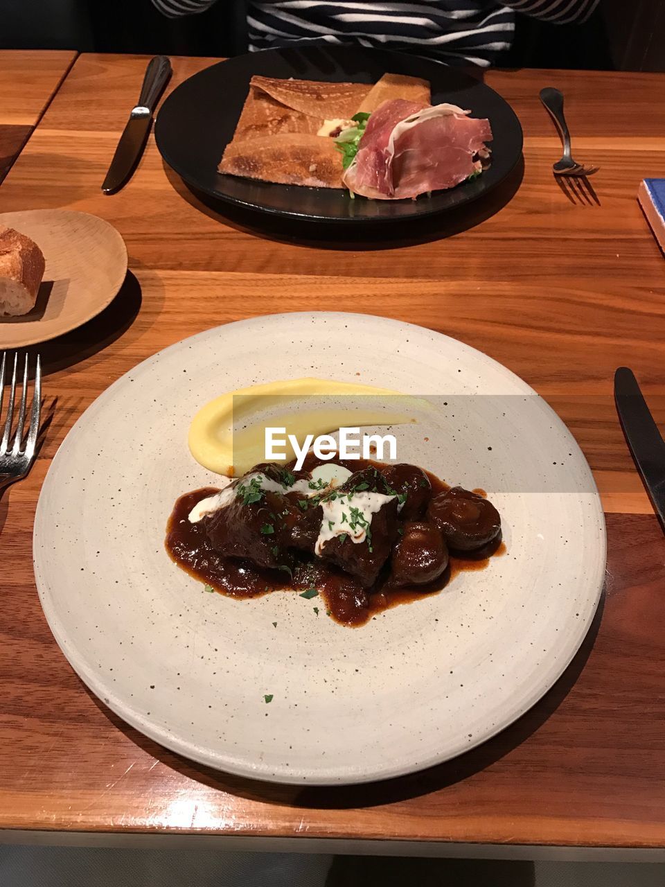 CLOSE-UP OF SERVED FOOD ON TABLE