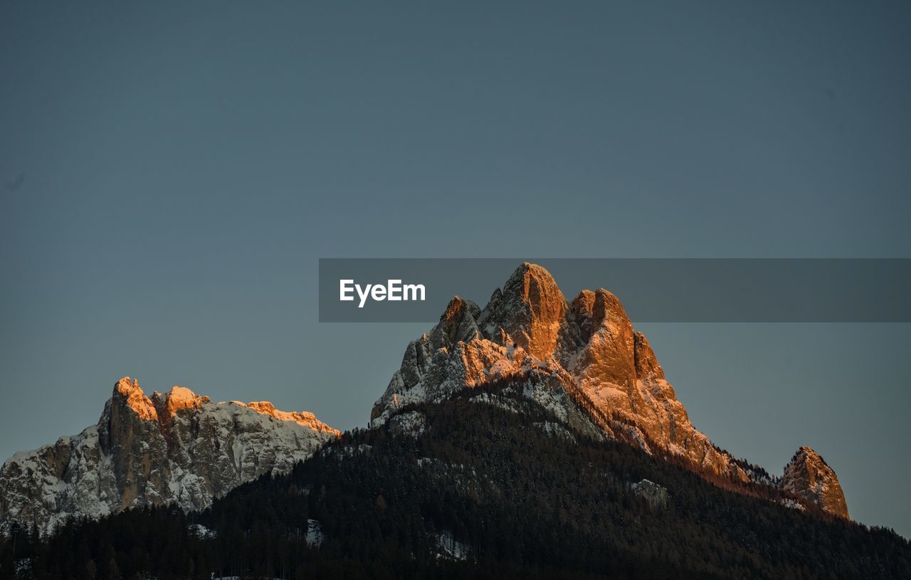 Low angle view of rock formation against sky