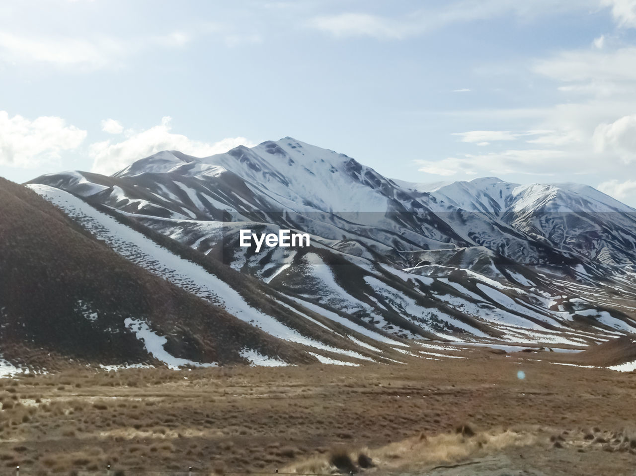 Scenic view of mountains against sky during winter