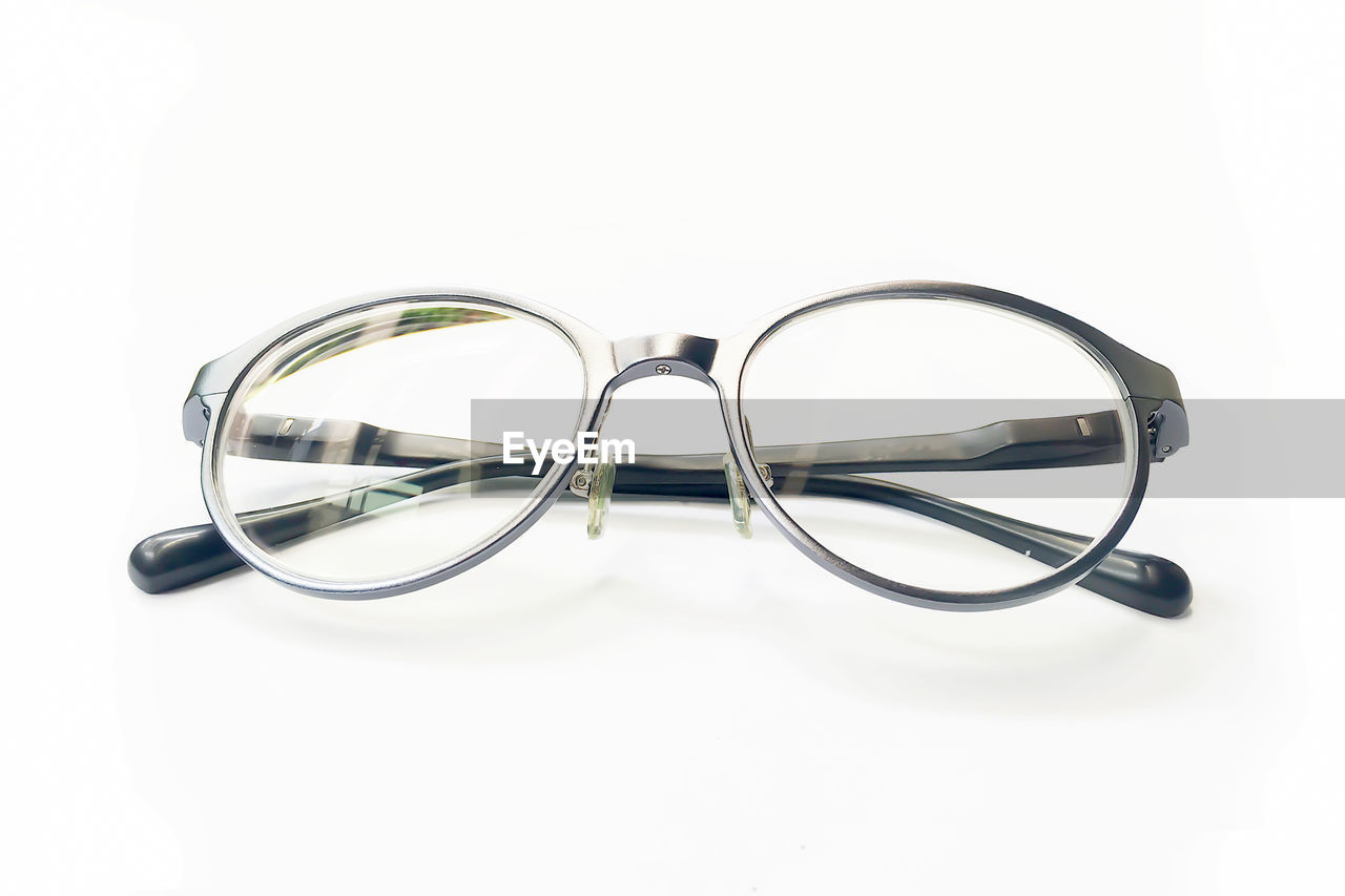 Close-up of eyeglasses on white background