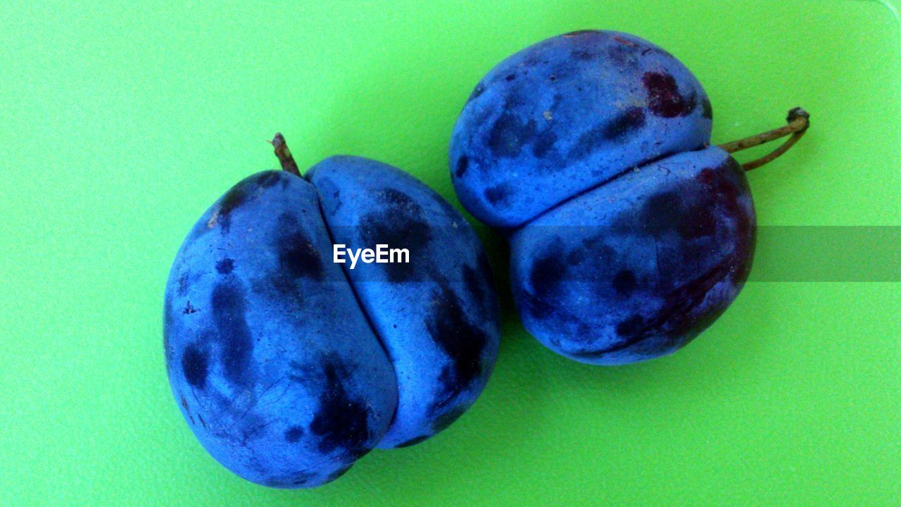 CLOSE-UP OF RED FRUITS ON TREE