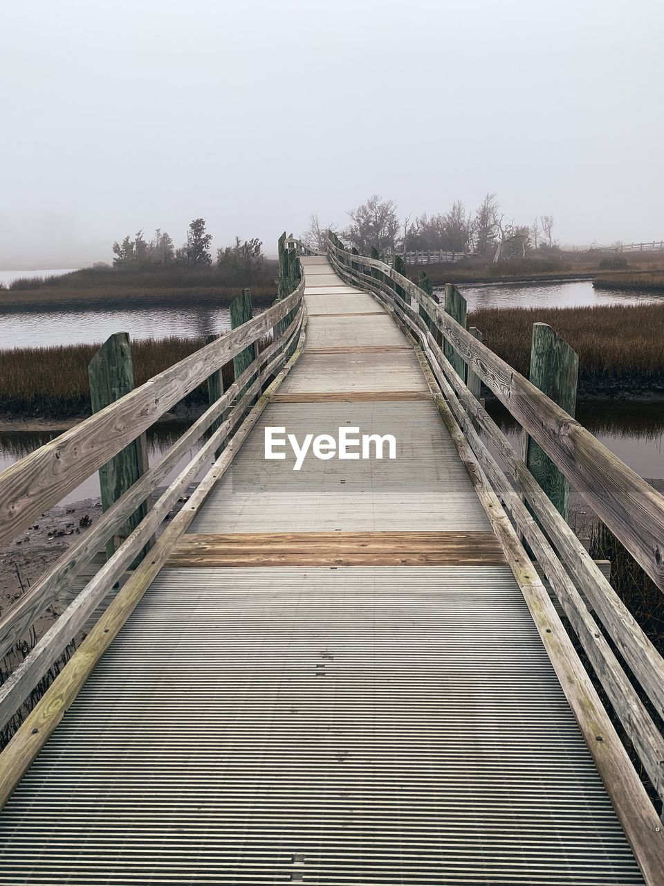 VIEW OF WOODEN FOOTBRIDGE ALONG CANAL