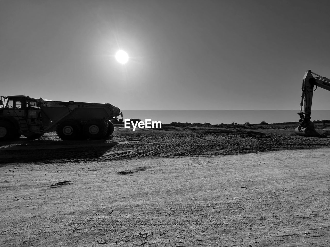 black and white, transportation, sky, monochrome, monochrome photography, mode of transportation, nature, vehicle, land, white, land vehicle, black, no people, environment, outdoors