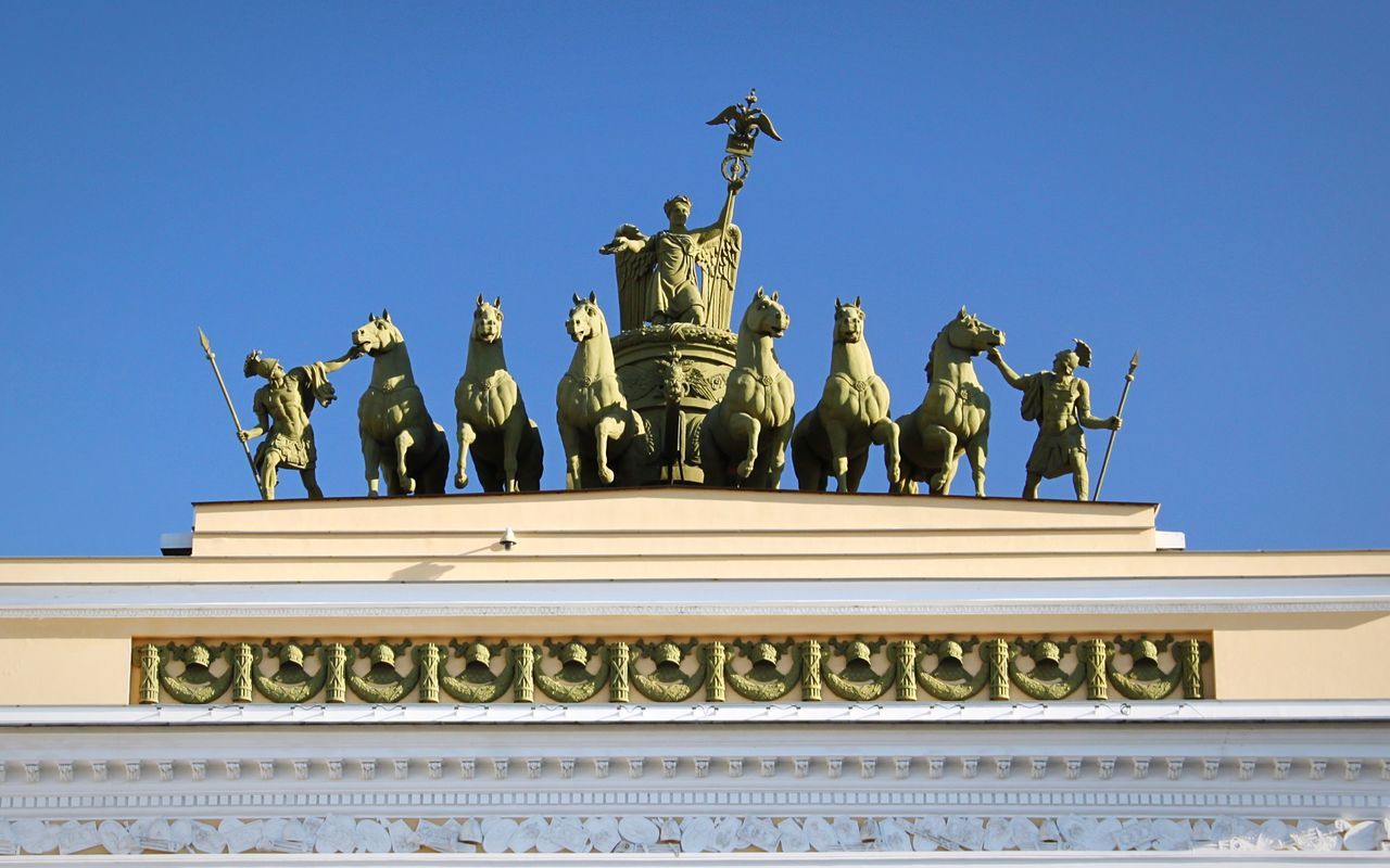 LOW ANGLE VIEW OF STATUES AGAINST SKY