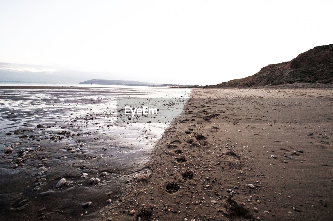 Scenic view of beach against clear sky