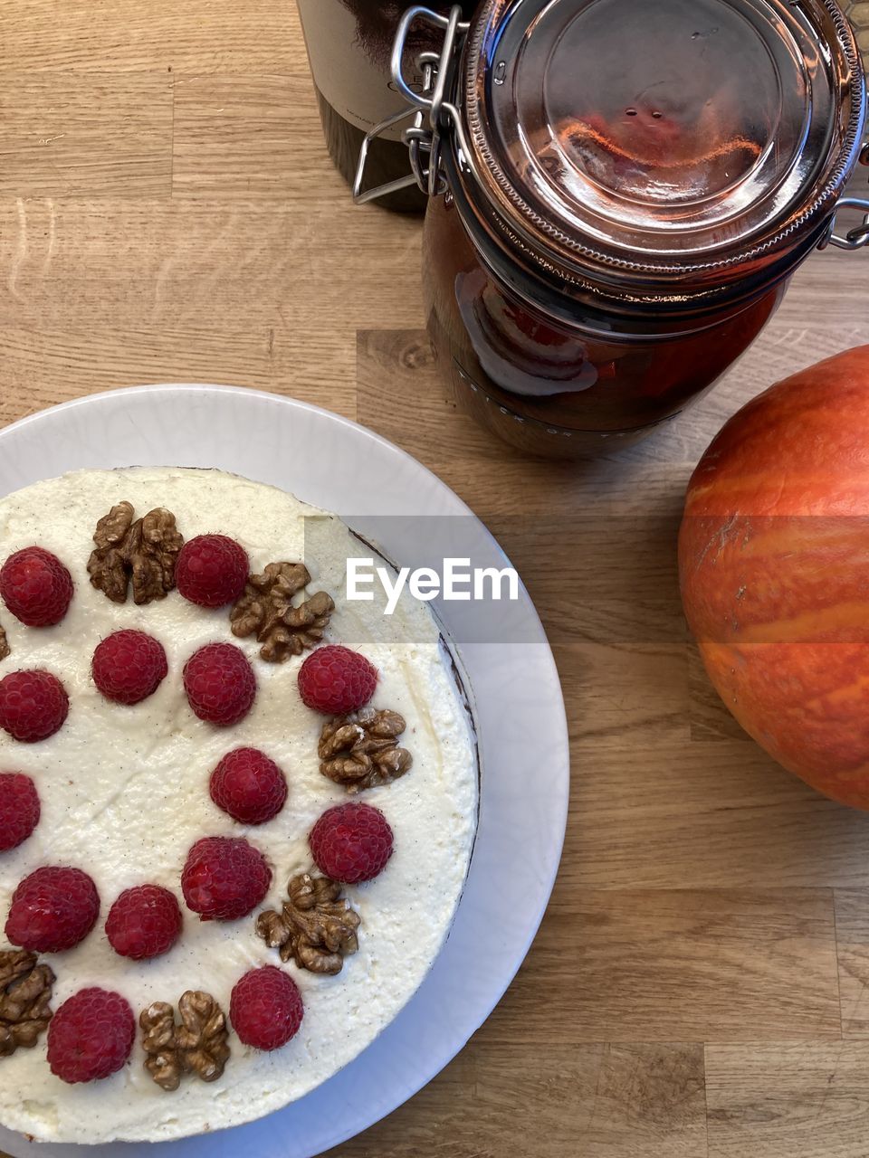 food and drink, food, fruit, healthy eating, produce, freshness, table, wellbeing, dish, wood, high angle view, indoors, meal, breakfast, no people, sweet food, plant, berry, still life, bowl, raspberry, dessert, seed, drink, directly above, cranberry