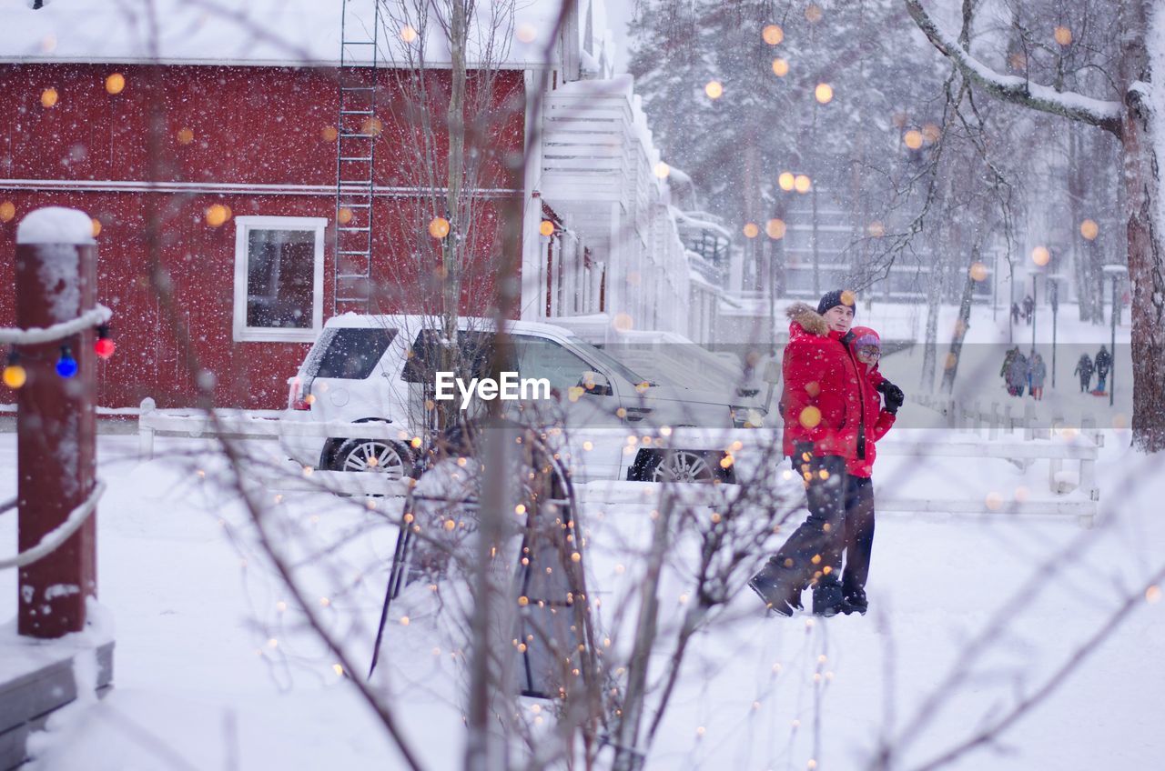 MAN IN SNOW COVERED CAR