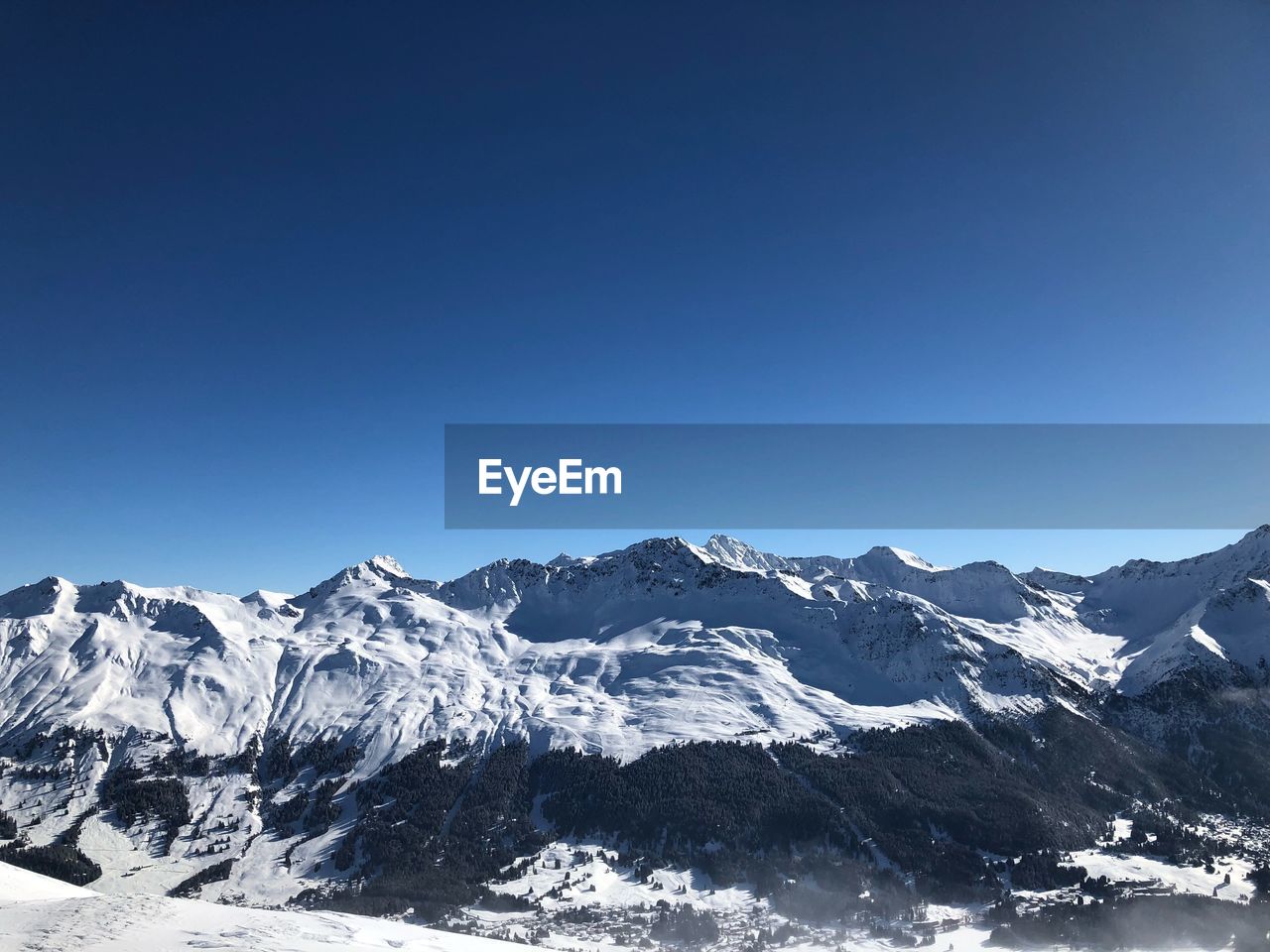 SNOWCAPPED MOUNTAIN AGAINST CLEAR BLUE SKY