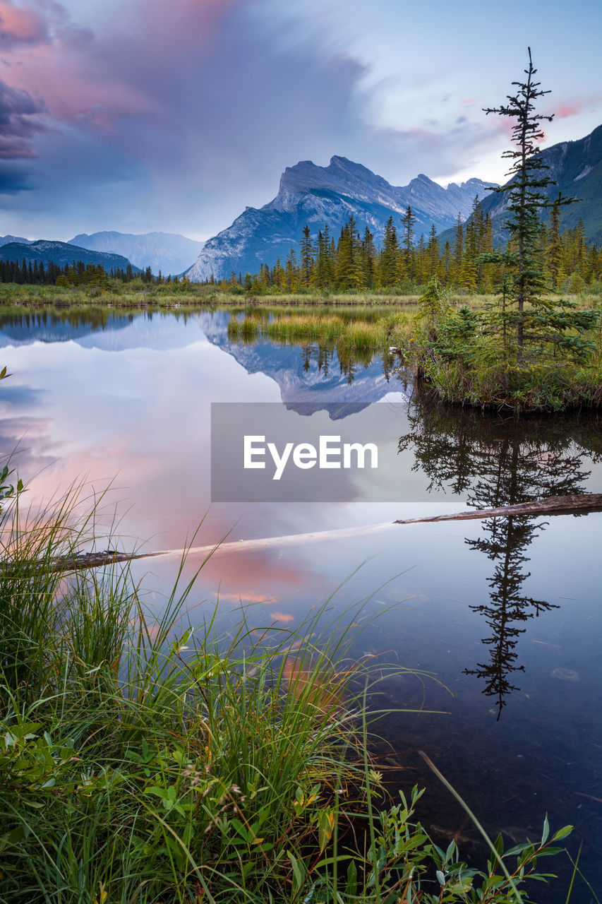 Scenic view of lake and mountains against sky