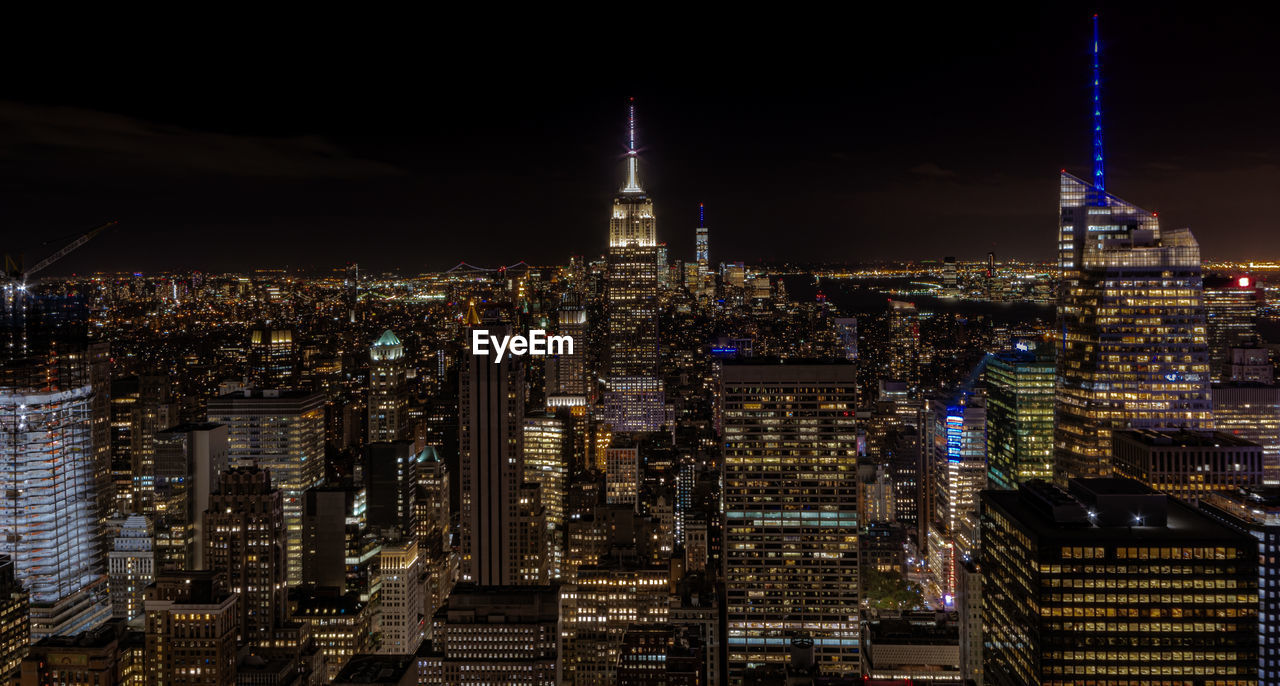 Illuminated buildings in city at night