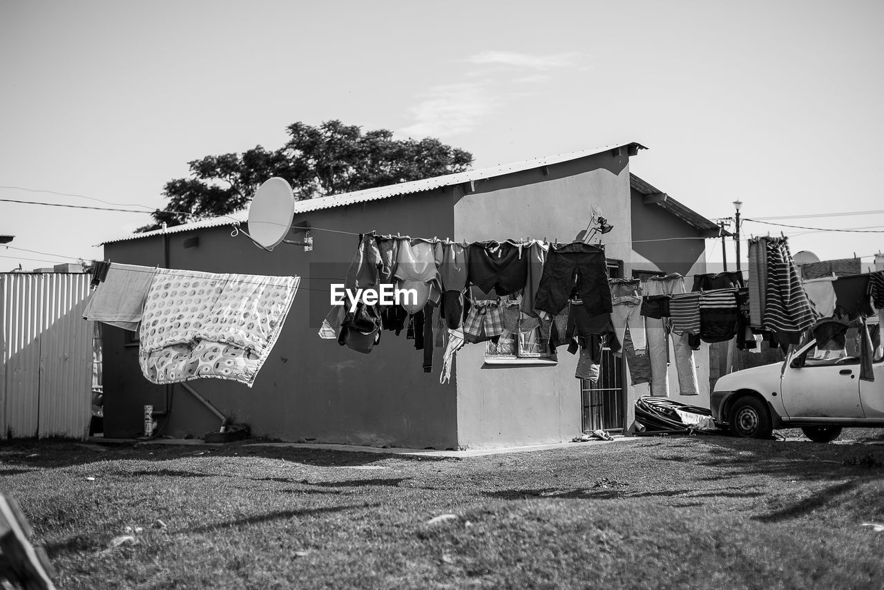 CLOTHES DRYING AGAINST BUILDINGS