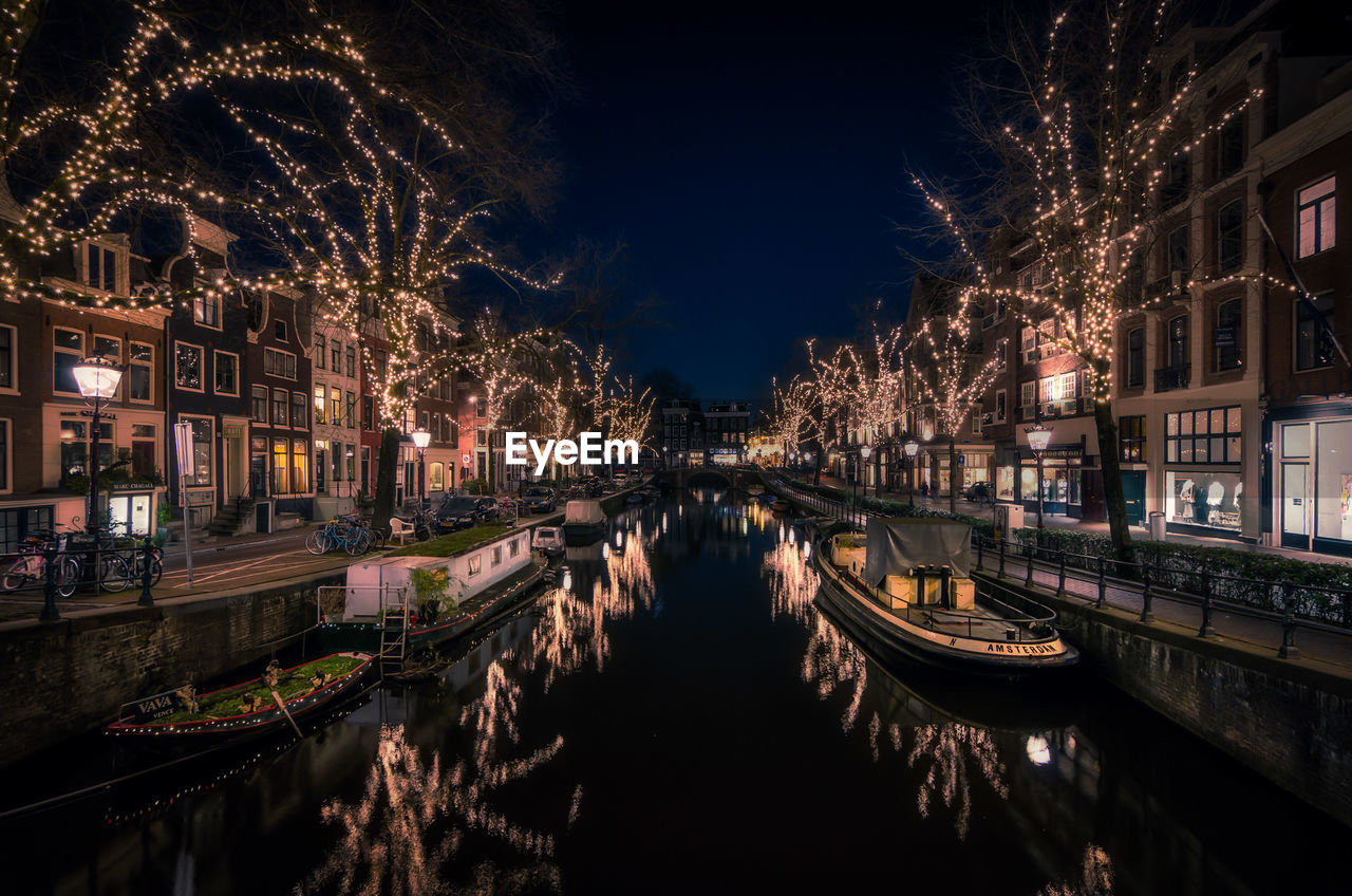 Panoramic view of illuminated buildings in city at night