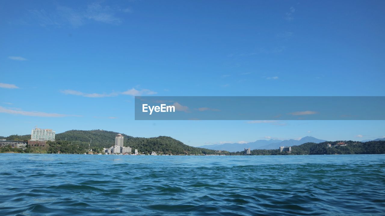 Scenic view of sea against blue sky