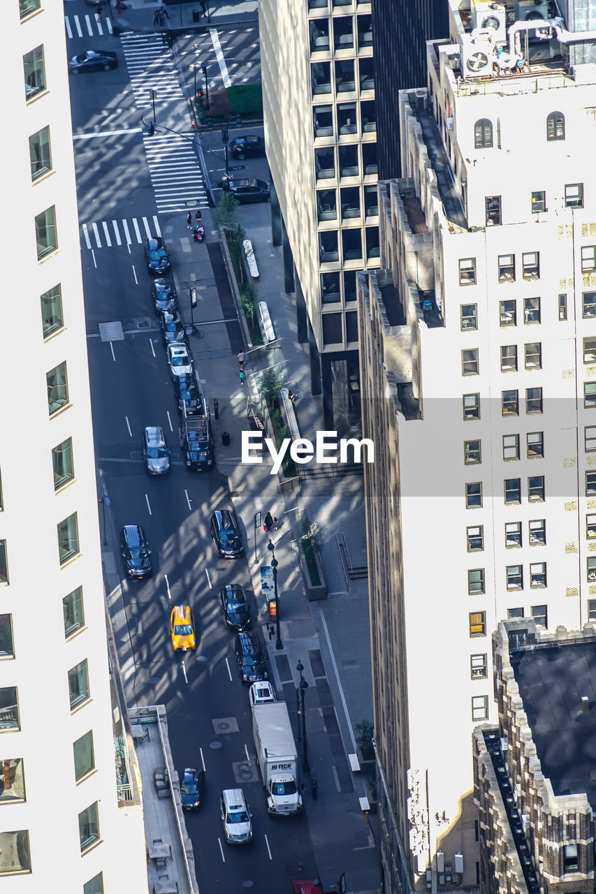 high angle view of people walking on street in city