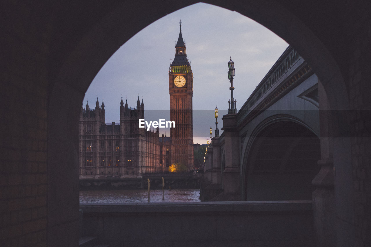 Westminster bridge over thames river against big ben