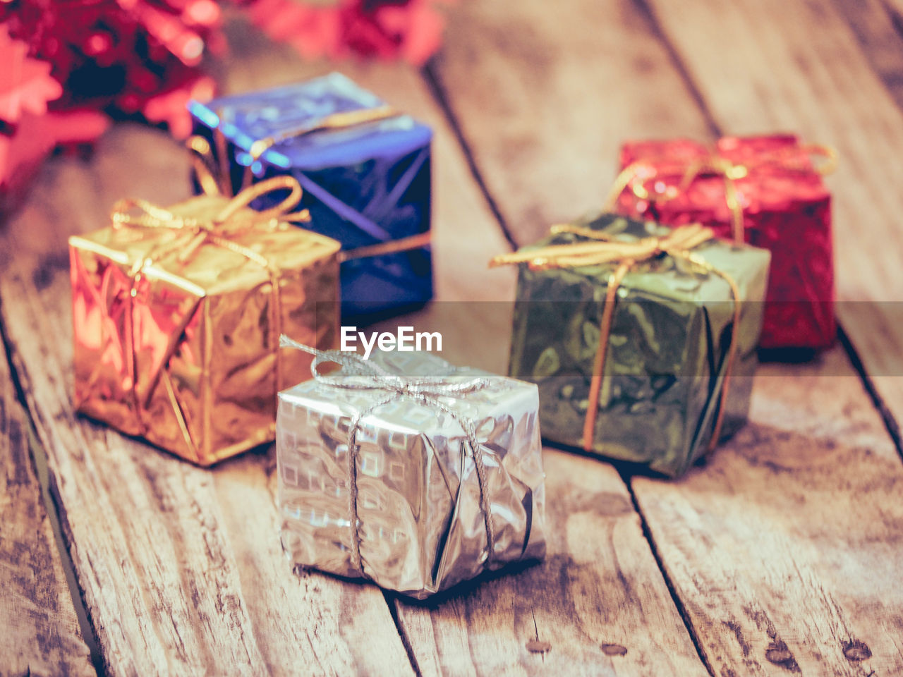 Close-up of colorful gift boxes on wooden table