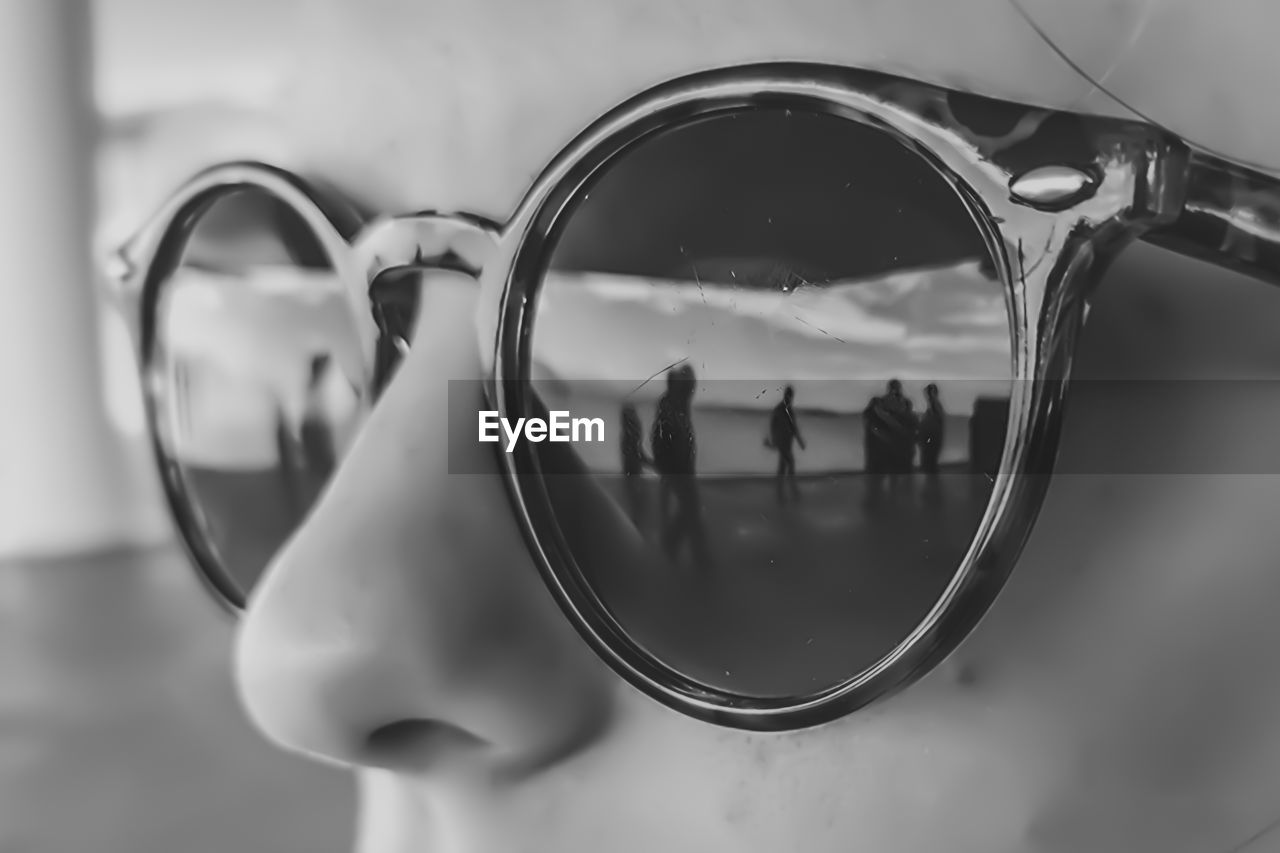 Close-up of woman sunglasses with reflection