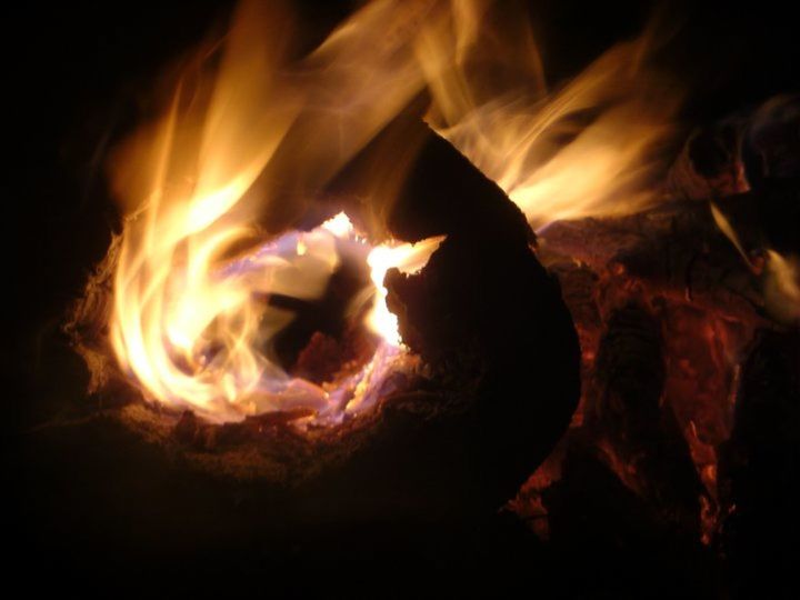 CLOSE-UP OF BONFIRE IN A FIRE