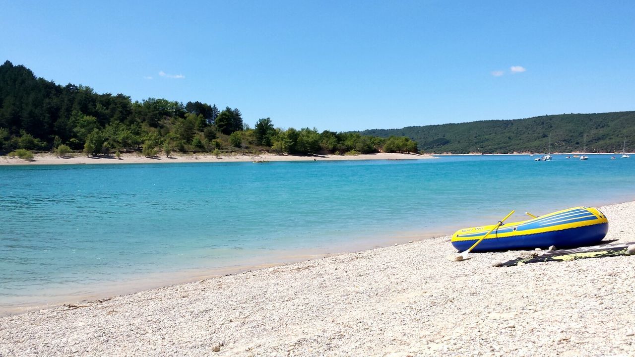 View of calm beach against the sky