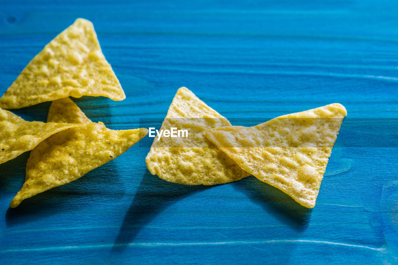 HIGH ANGLE VIEW OF BREAD ON BLUE TABLE