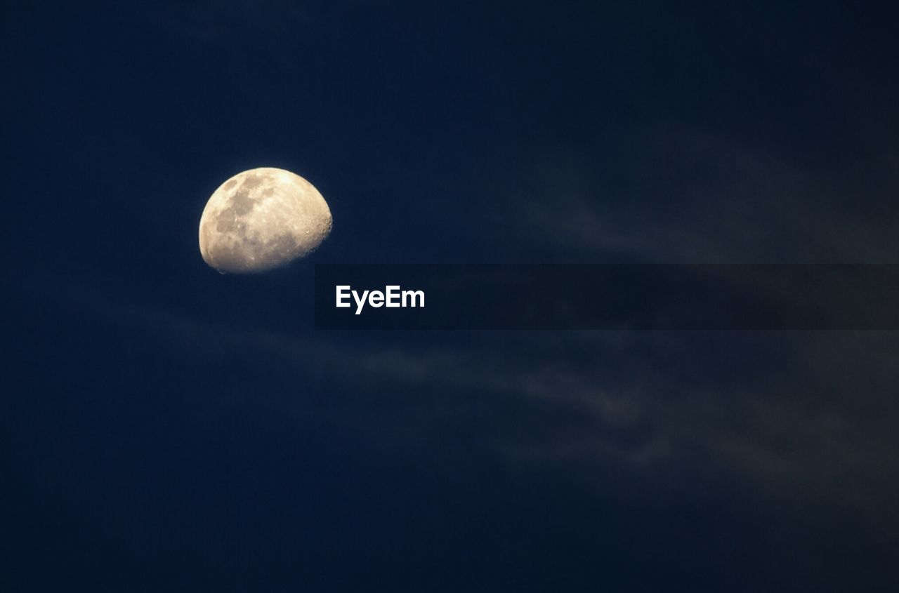 LOW ANGLE VIEW OF MOON IN SKY