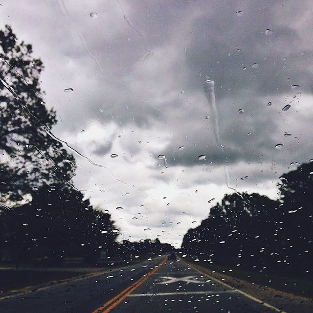 ROAD SEEN THROUGH CAR WINDSHIELD