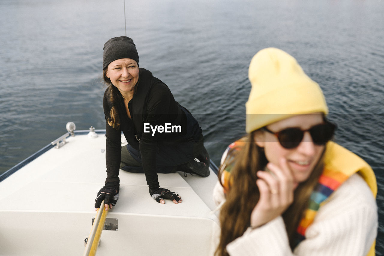 Smiling women on sailing boat