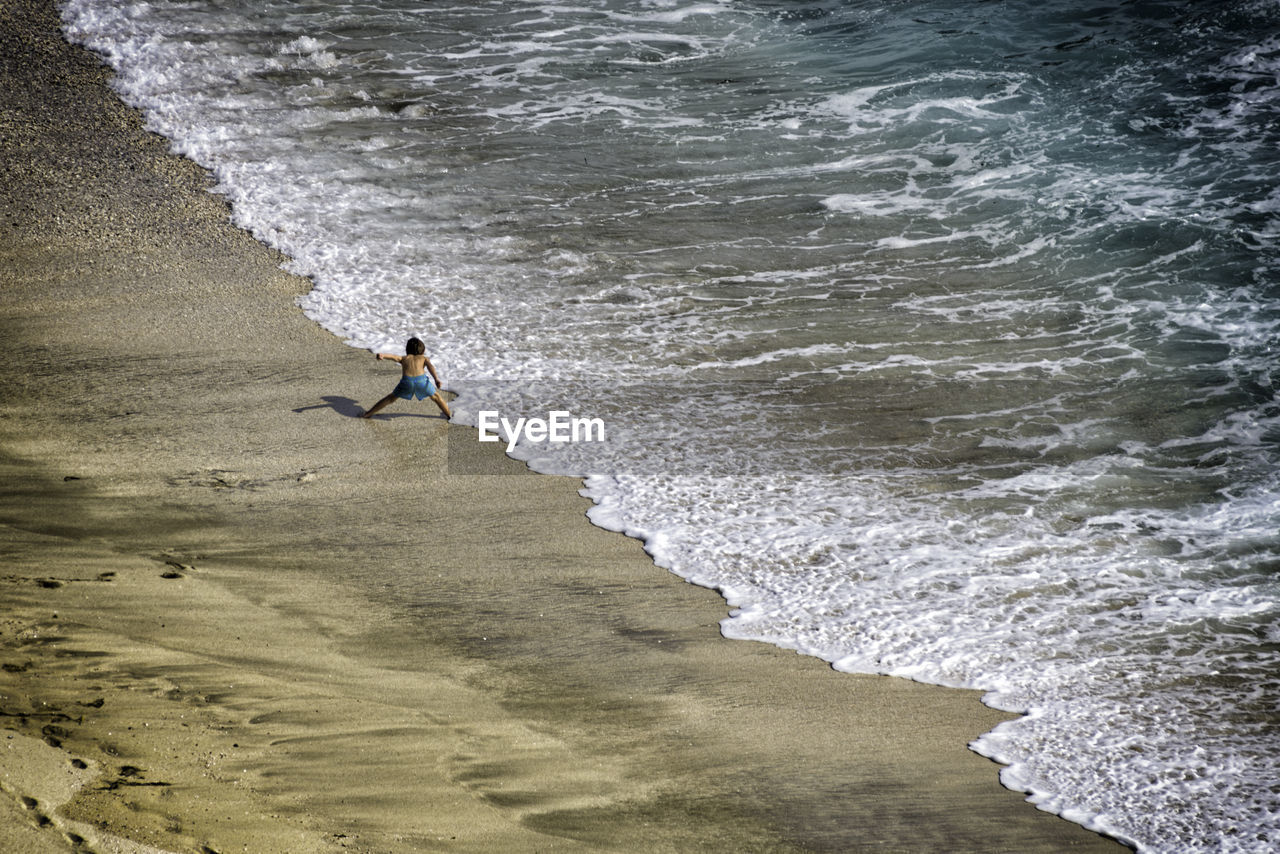 Man surfing on beach