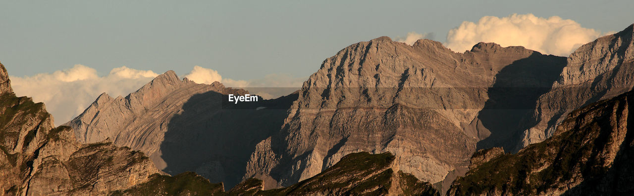 panoramic view of snowcapped mountains against sky during sunset
