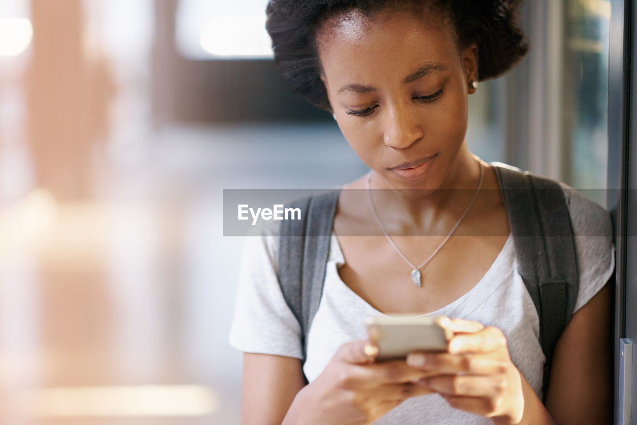 Young woman using mobile phone