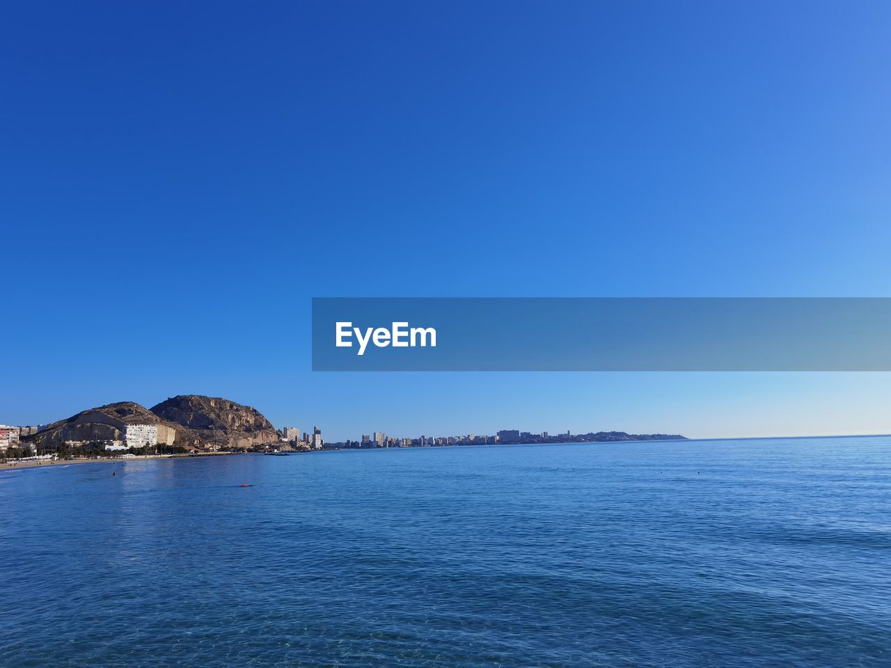 VIEW OF SEA AGAINST CLEAR BLUE SKY