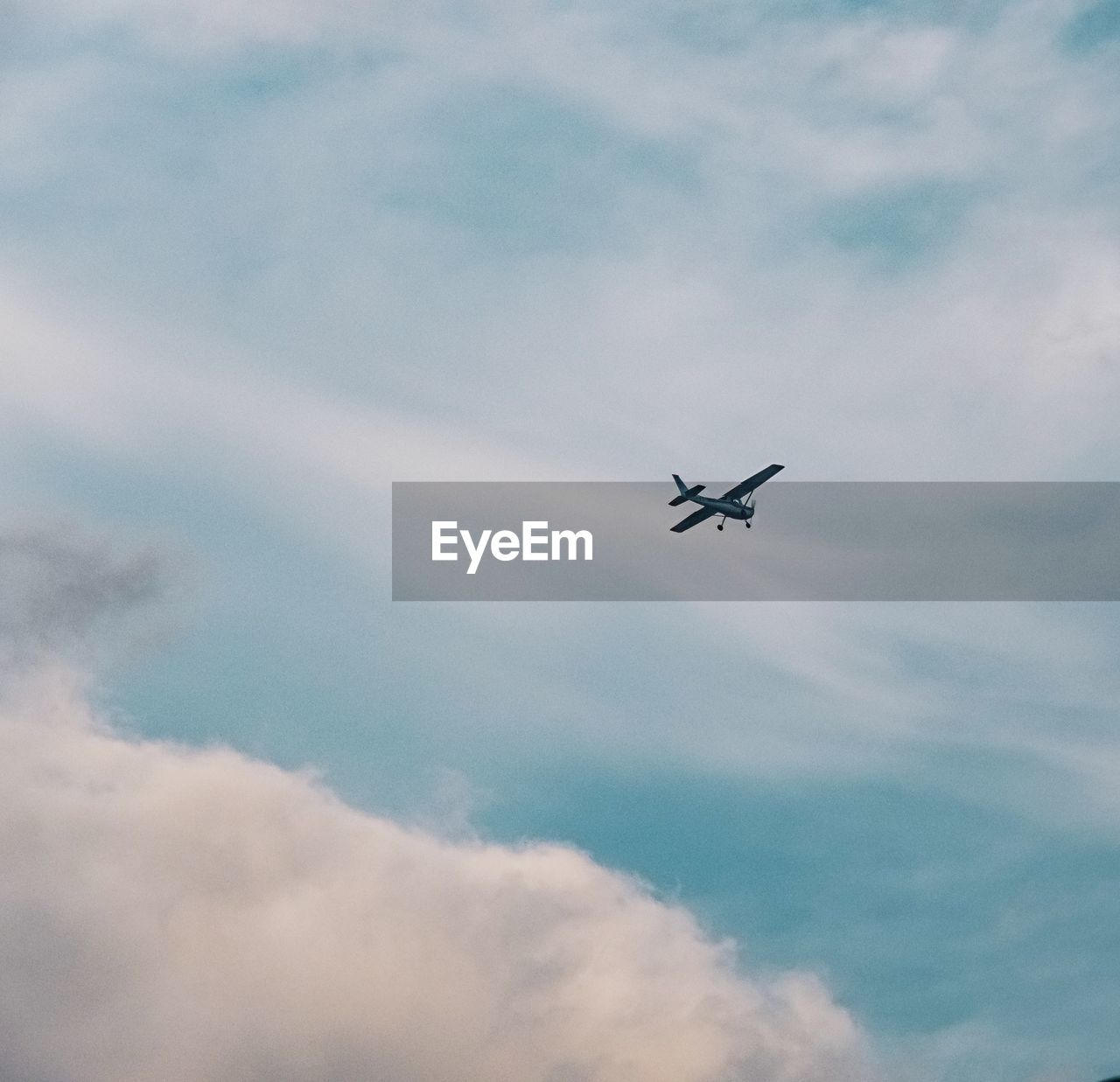 Low angle view of airplane flying in sky