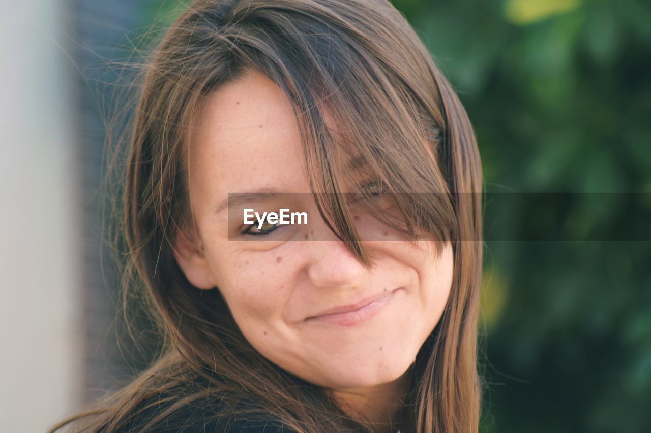 Portrait of smiling young woman