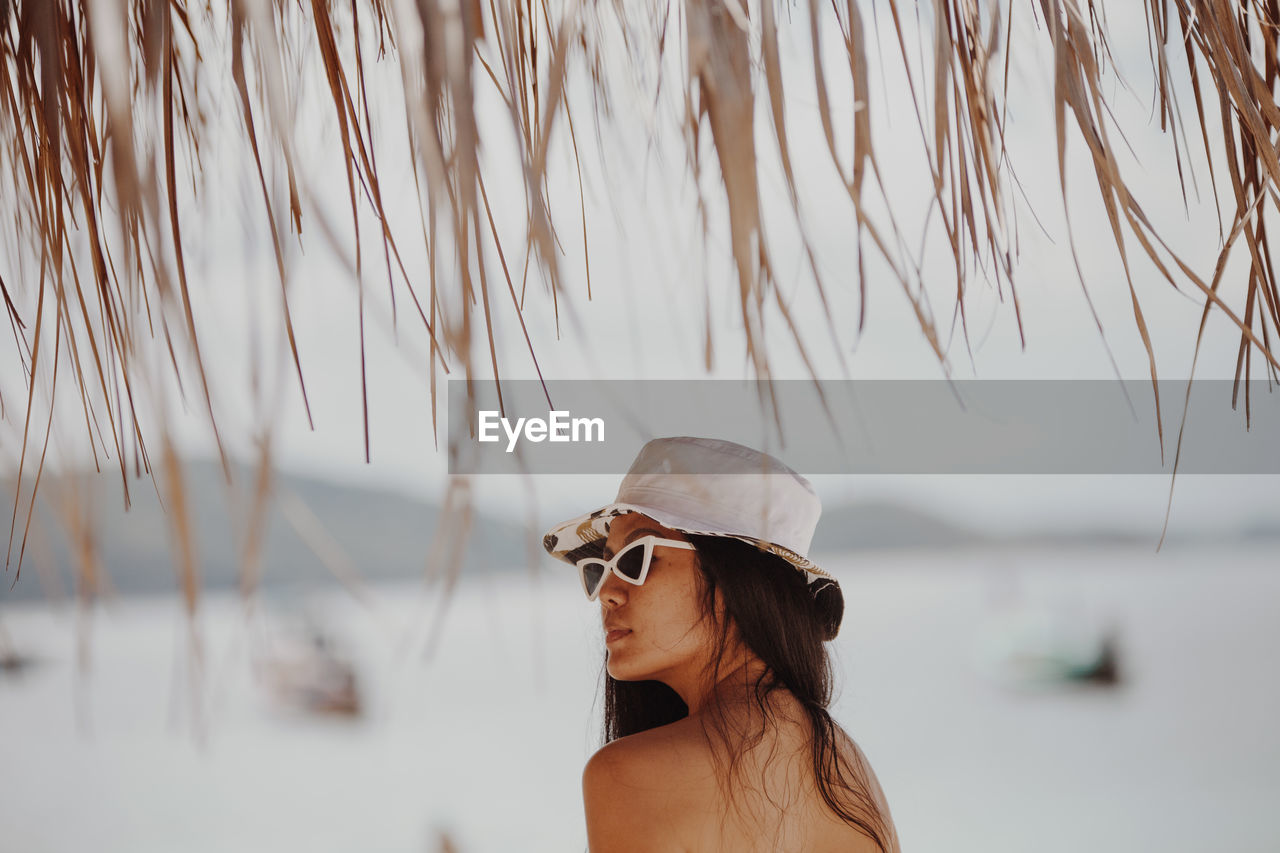 Woman wearing sunglasses at beach