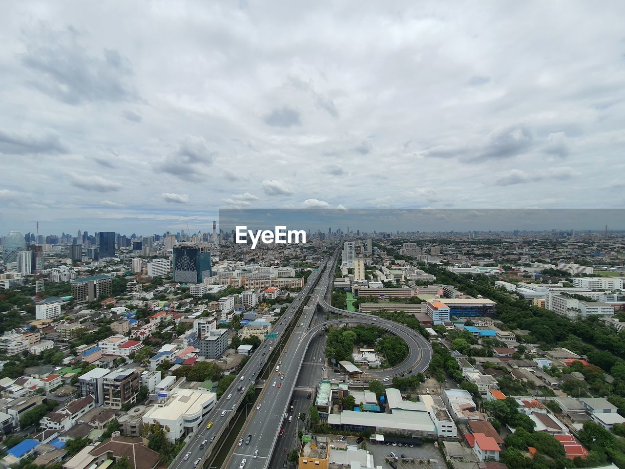 High angle view of city street and buildings against sky