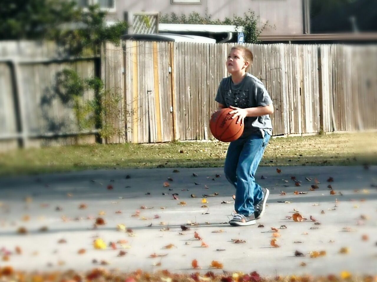 MAN PLAYING WITH BALL IN BACKGROUND