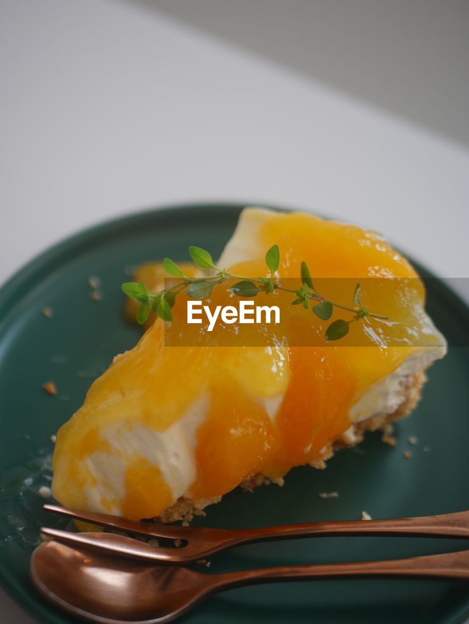 food, food and drink, healthy eating, egg yolk, indoors, egg, freshness, wellbeing, plant, produce, kitchen utensil, close-up, meal, no people, yellow, fruit, dish, eating utensil, still life, studio shot, high angle view, spoon, directly above, breakfast, household equipment