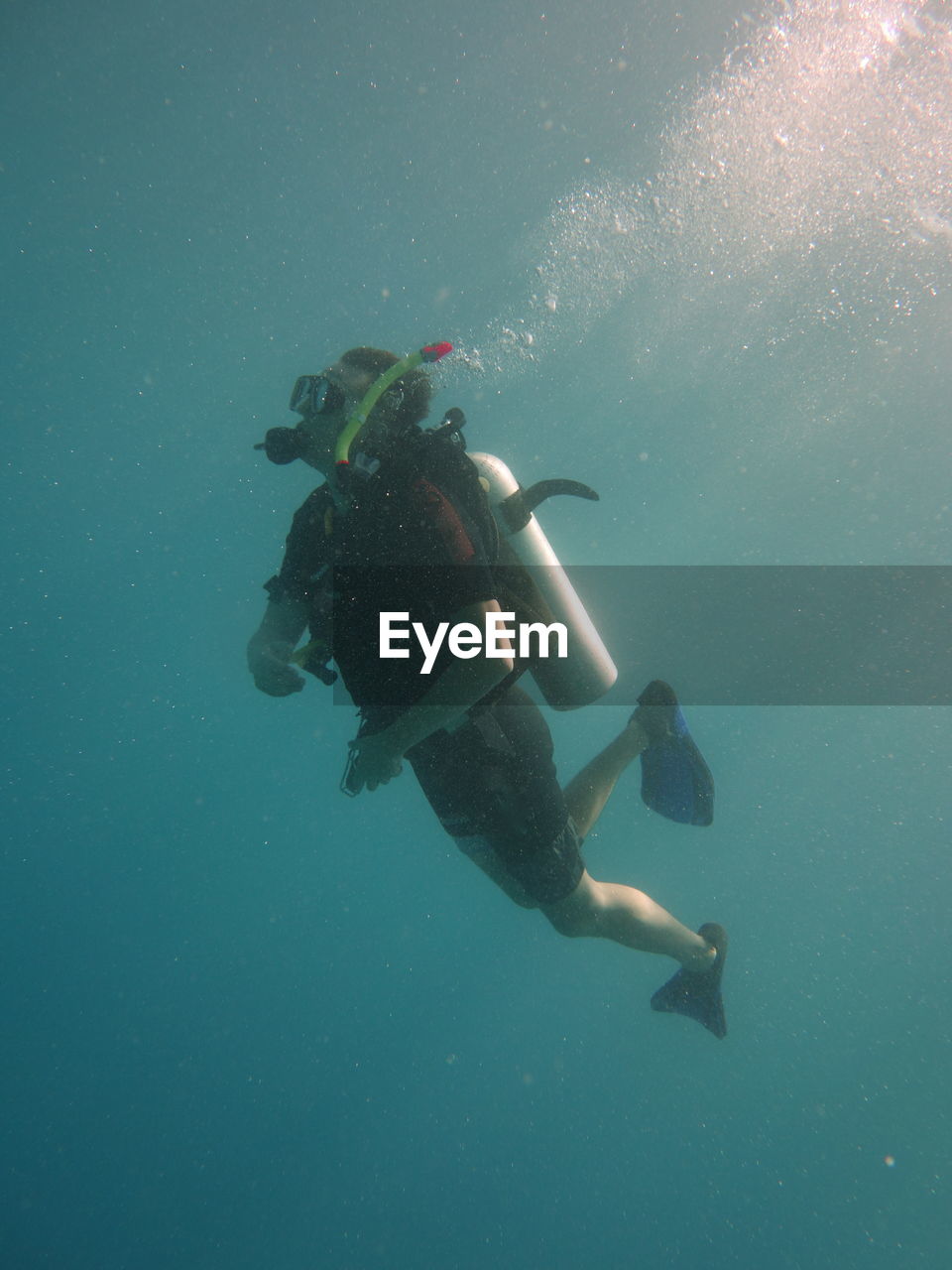 Full length of man scuba diving in sea