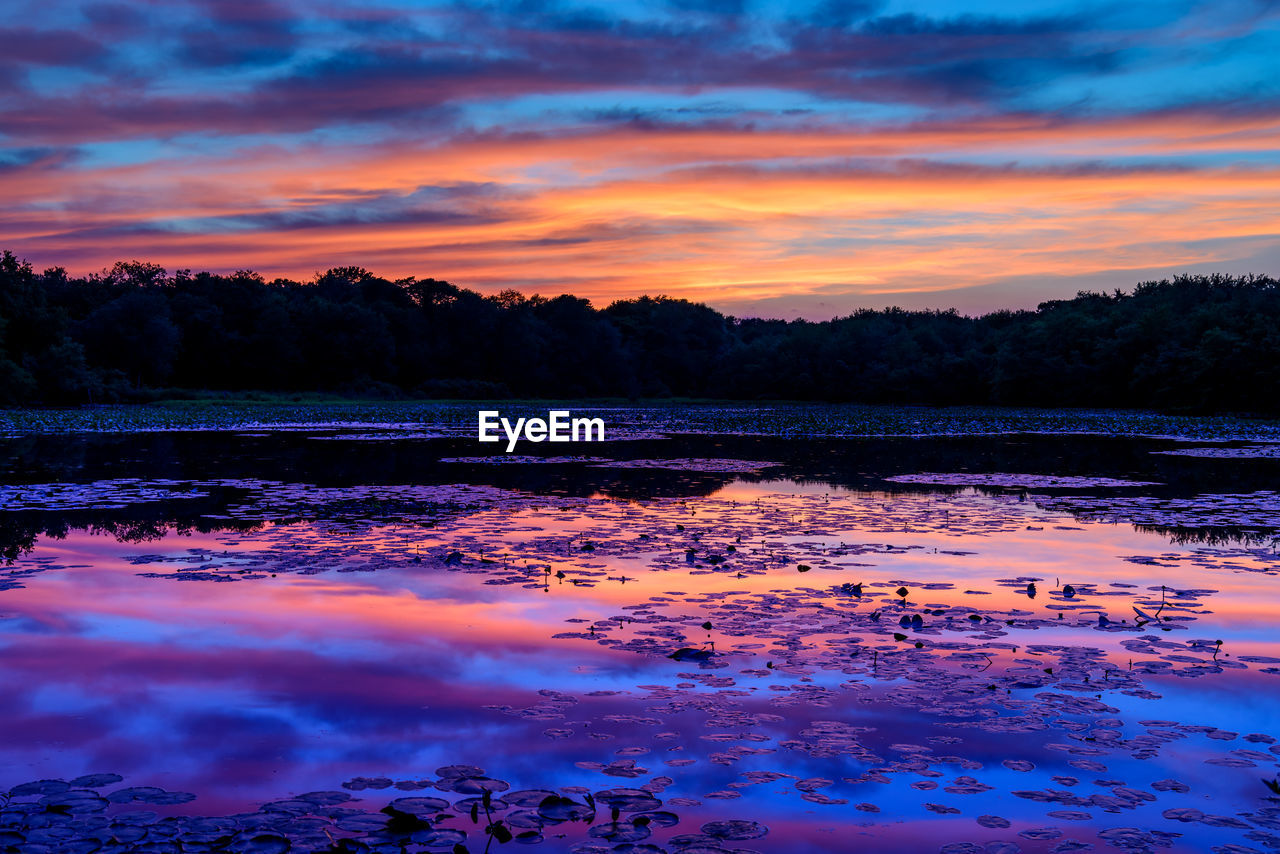 REFLECTION OF CLOUDS IN LAKE WATER