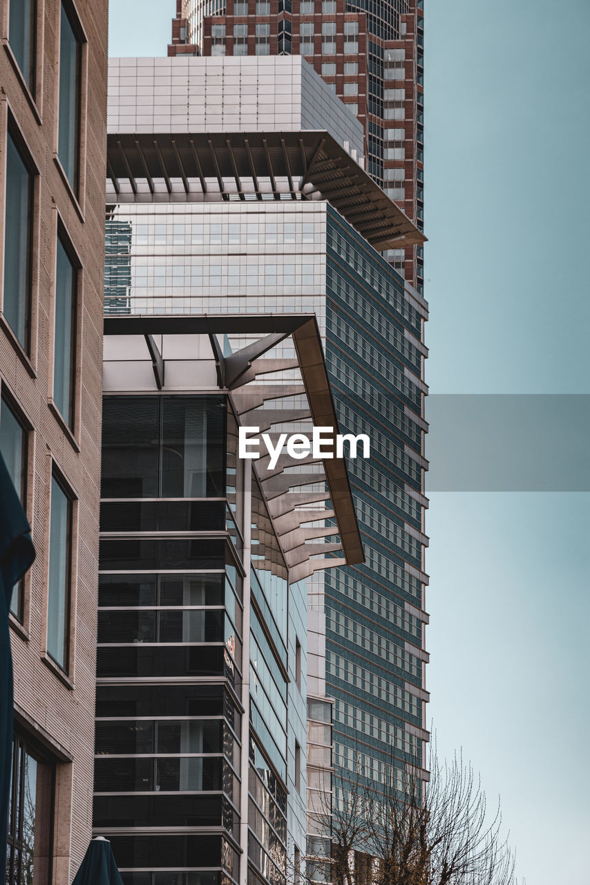 Low angle view of modern buildings against clear sky