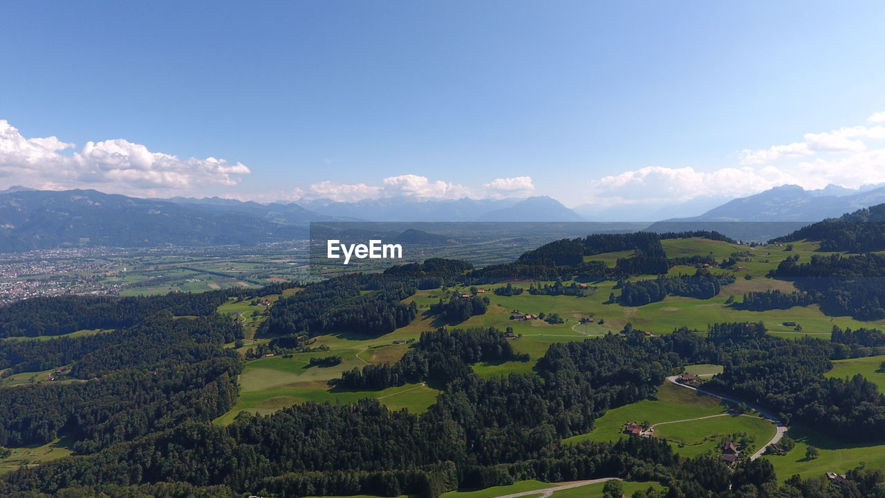 Scenic view of landscape and mountains against sky