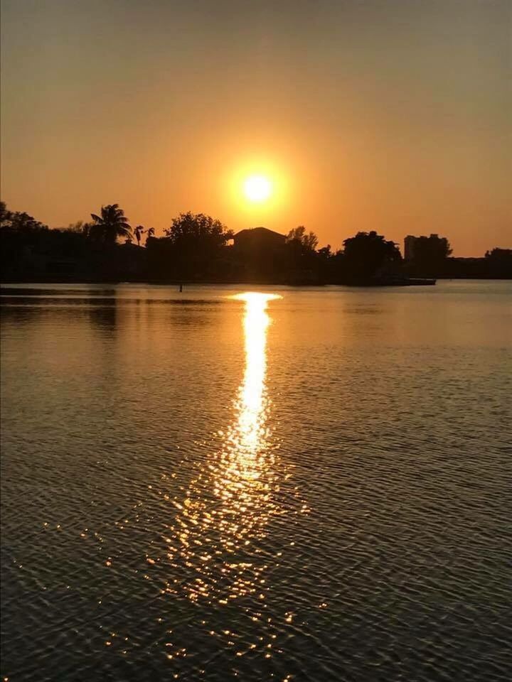 SCENIC VIEW OF SUNSET OVER RIVER