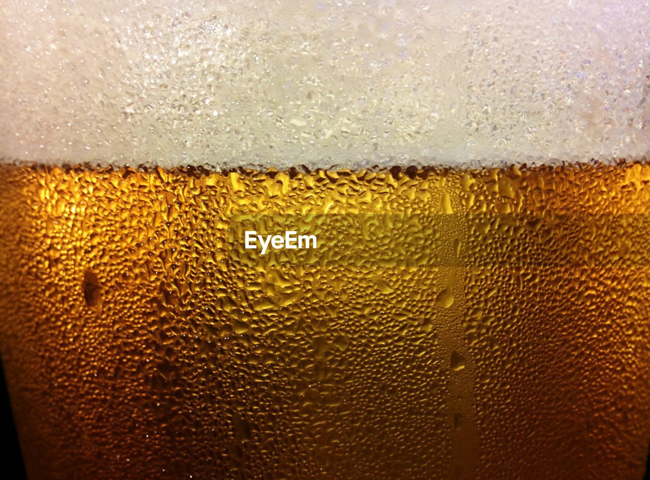 Extreme close-up of beer glass